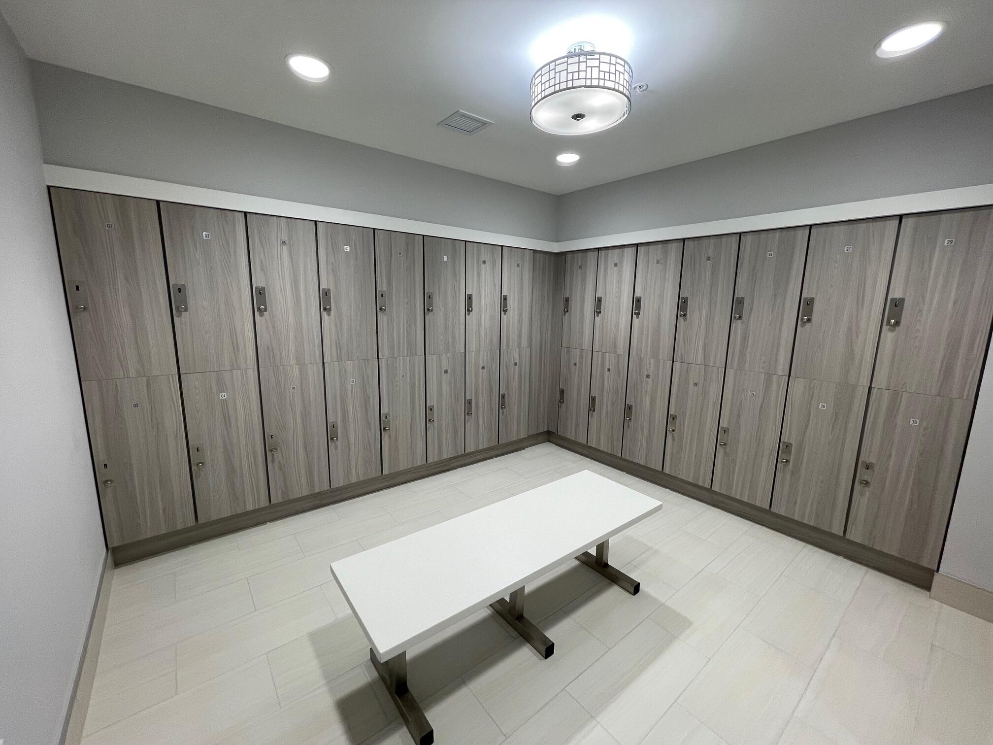 6157 Sunny Pointe Circle Delray Beach, FL 33484 - Photo 56 of 64 a view of a hallway with wooden cabinets