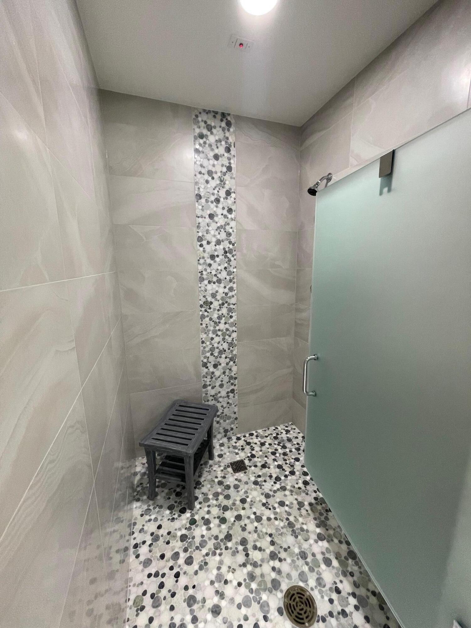 6157 Sunny Pointe Circle Delray Beach, FL 33484 - Photo 57 of 64 a bathroom with a toilet and a shower