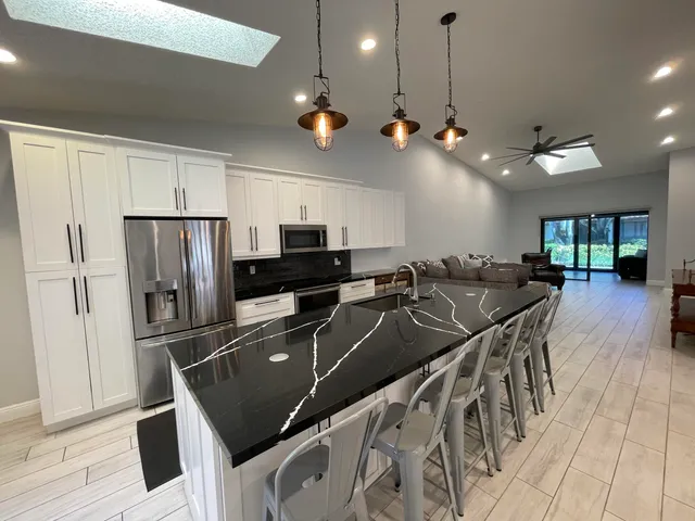 a view of washer and dryer with wooden floor