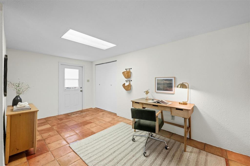 4610 South 1st Street Austin, TX 78745 - Photo 11 of 23 Office space with a skylight and light tile patterned flooring