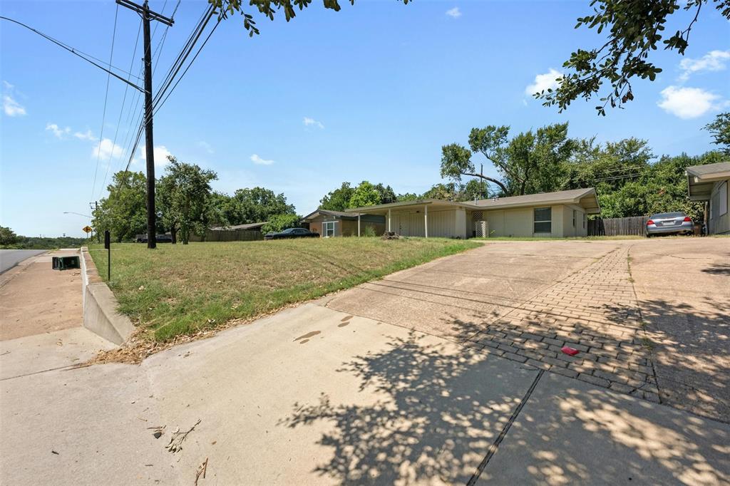 4610 South 1st Street Austin, TX 78745 - Photo 22 of 23 Single story home featuring driveway and a front lawn