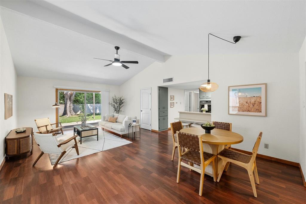 4610 South 1st Street Austin, TX 78745 - Photo 4 of 23 Dining space with ceiling fan, wood finished floors, and baseboards