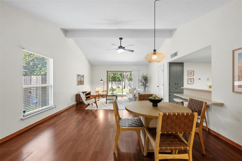 4610 South 1st Street Austin, TX 78745 - Photo 5 of 23 Dining area with ceiling fan, wood finished floors, and baseboards