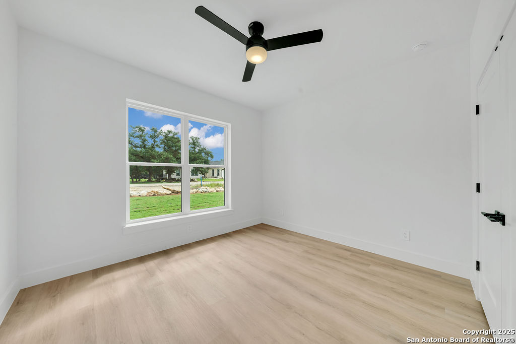 661 Jonquil Drive Spring Branch, TX 78070 - Photo 9 of 18 an empty room with a window