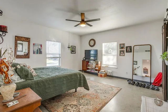 a view of a dining room with furniture and a kitchen