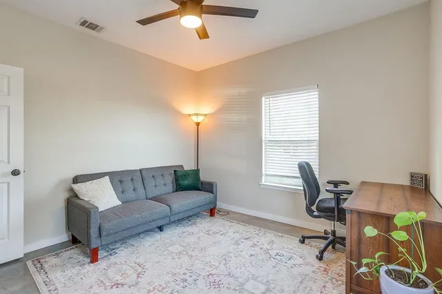 a living room with furniture and a window