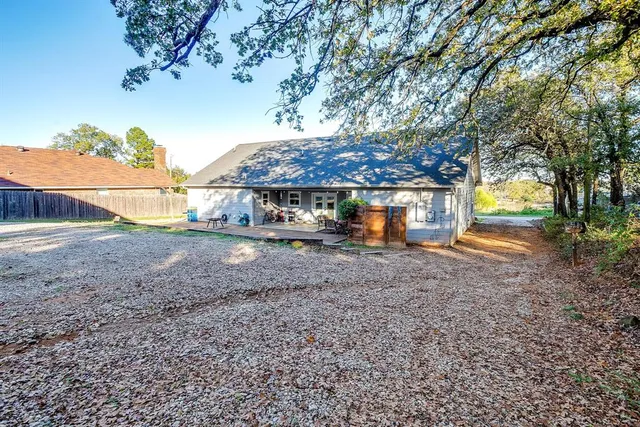 a living room with a couch and a chandelier