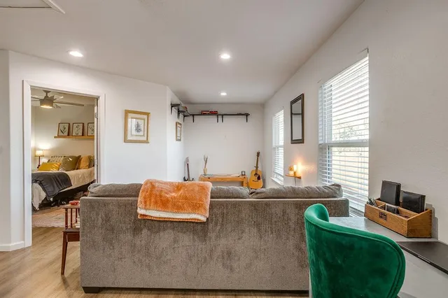 a kitchen with a sink white cabinets and stainless steel appliances