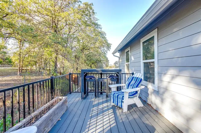 a bedroom with a large bed and a dresser