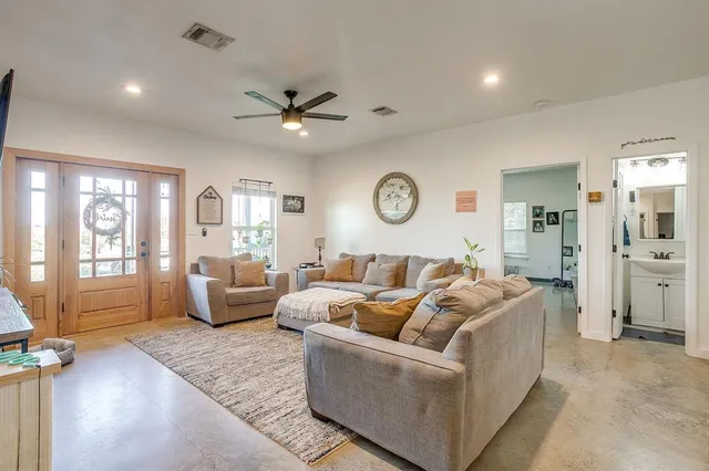 a living room with furniture and a large window