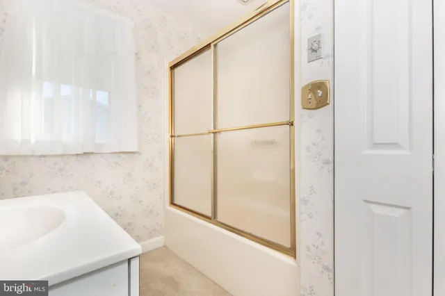 a bathroom with a sink and a shower