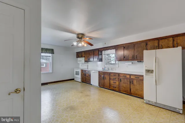 a kitchen with stainless steel appliances a refrigerator and a stove