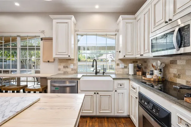 a bed room with a bed and a chair