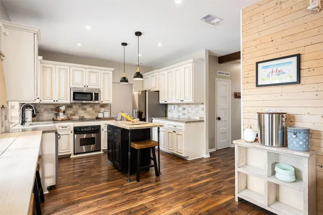 a view of a backyard with swimming pool