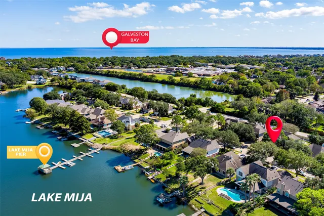 a kitchen with a sink stove and wooden floor