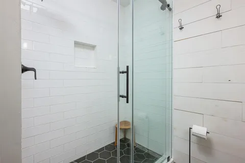 a bedroom with furniture and windows