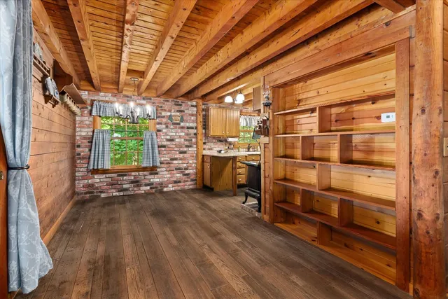 a kitchen with a sink appliances and cabinets