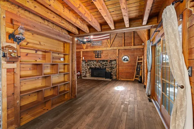 a view of a fireplace with wooden floor