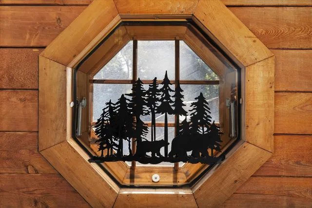 a view of a street with wooden wall