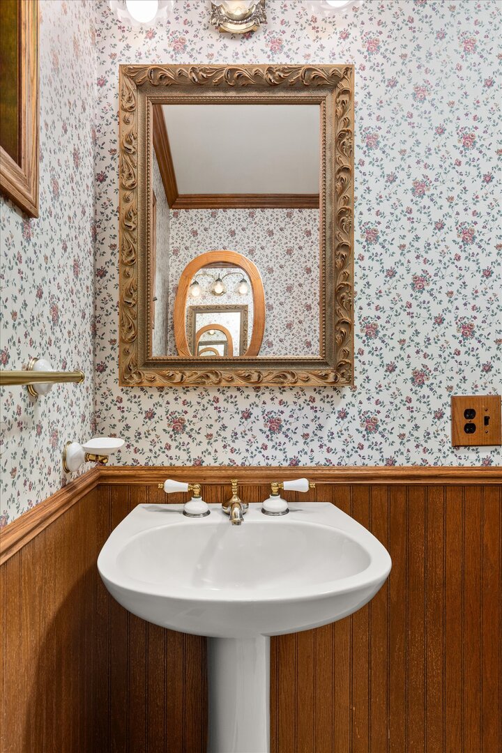 910 Durant Street Oglesby, IL 61348 - Photo 24 of 52 a bathroom with a sink and a mirror
