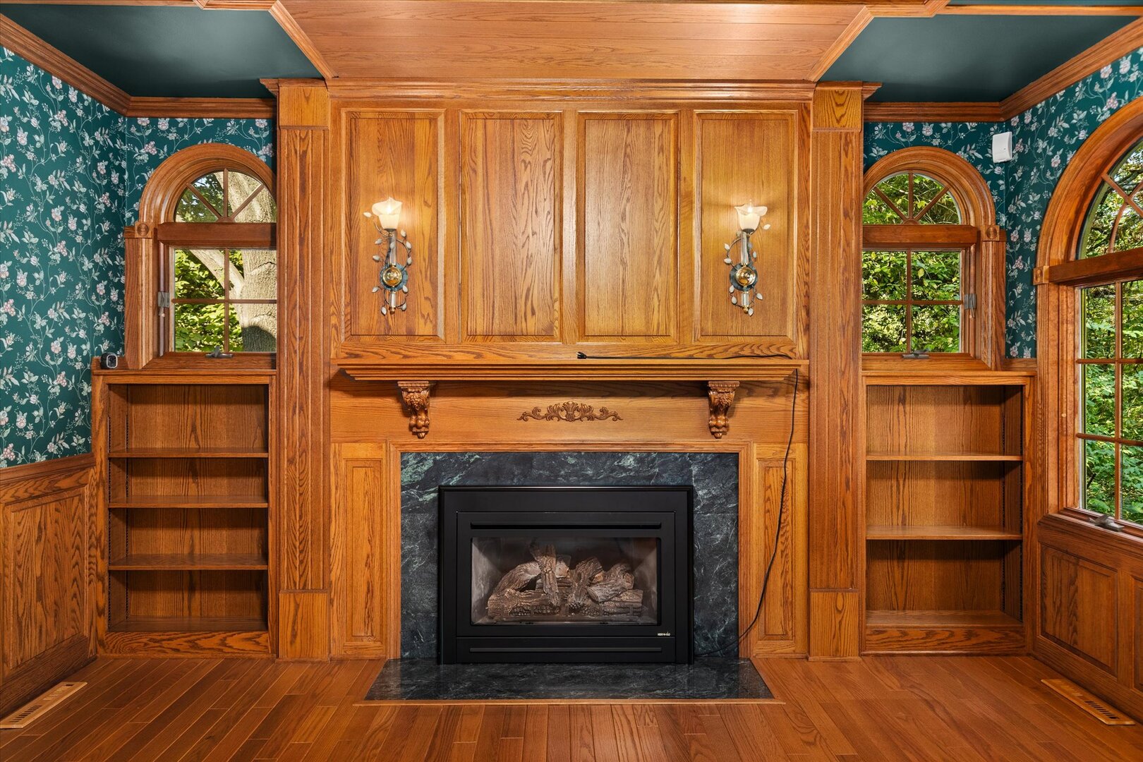 910 Durant Street Oglesby, IL 61348 - Photo 26 of 52 a living room with a fireplace and a window