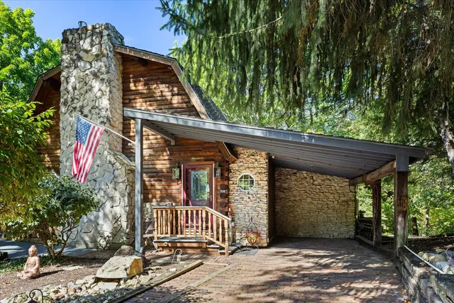 a view of a wooden door and bench