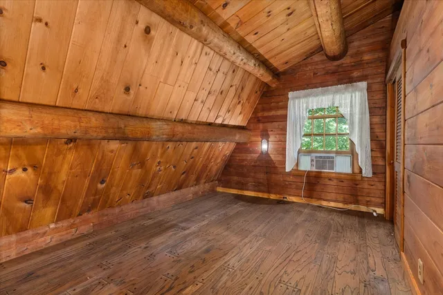 a view of a fireplace with wooden floor