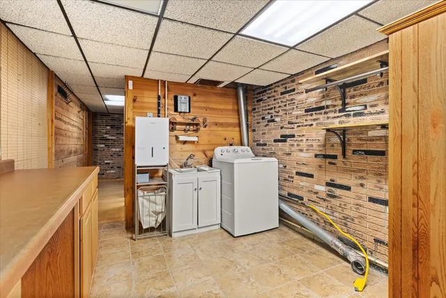 a bathroom with a shower and mirror