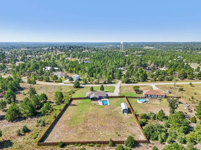 an aerial view of a house with a garden