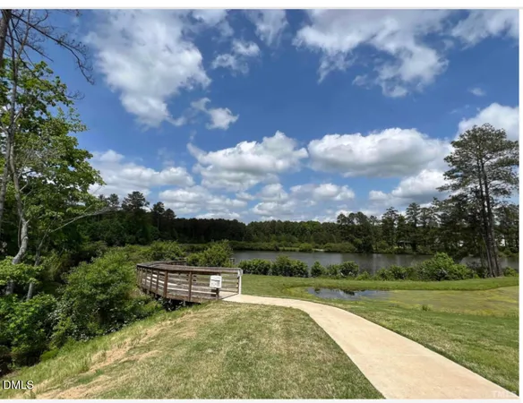 a view of a swimming pool with a yard