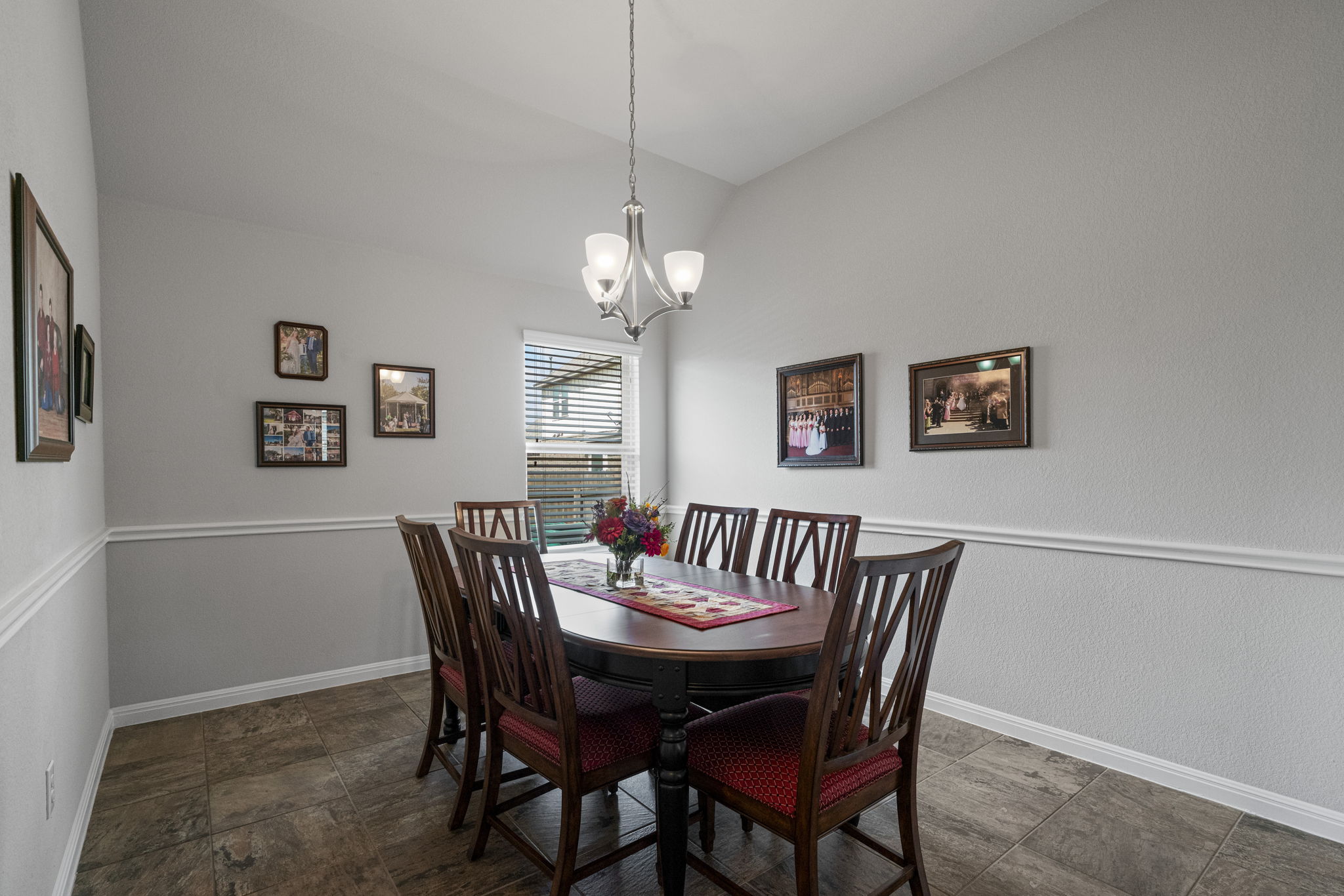 2009 Kates Cove Manchaca, TX 78652 - Photo 11 of 25 a view of a dining room with furniture and chandelier