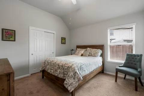 a bedroom with a bed and a dresser