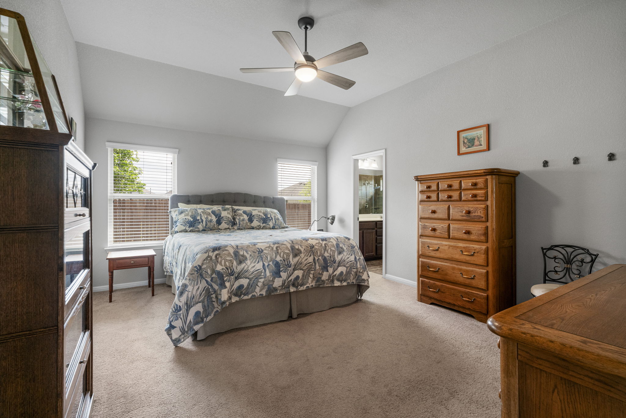 2009 Kates Cove Manchaca, TX 78652 - Photo 16 of 25 a bedroom with a bed and a dresser