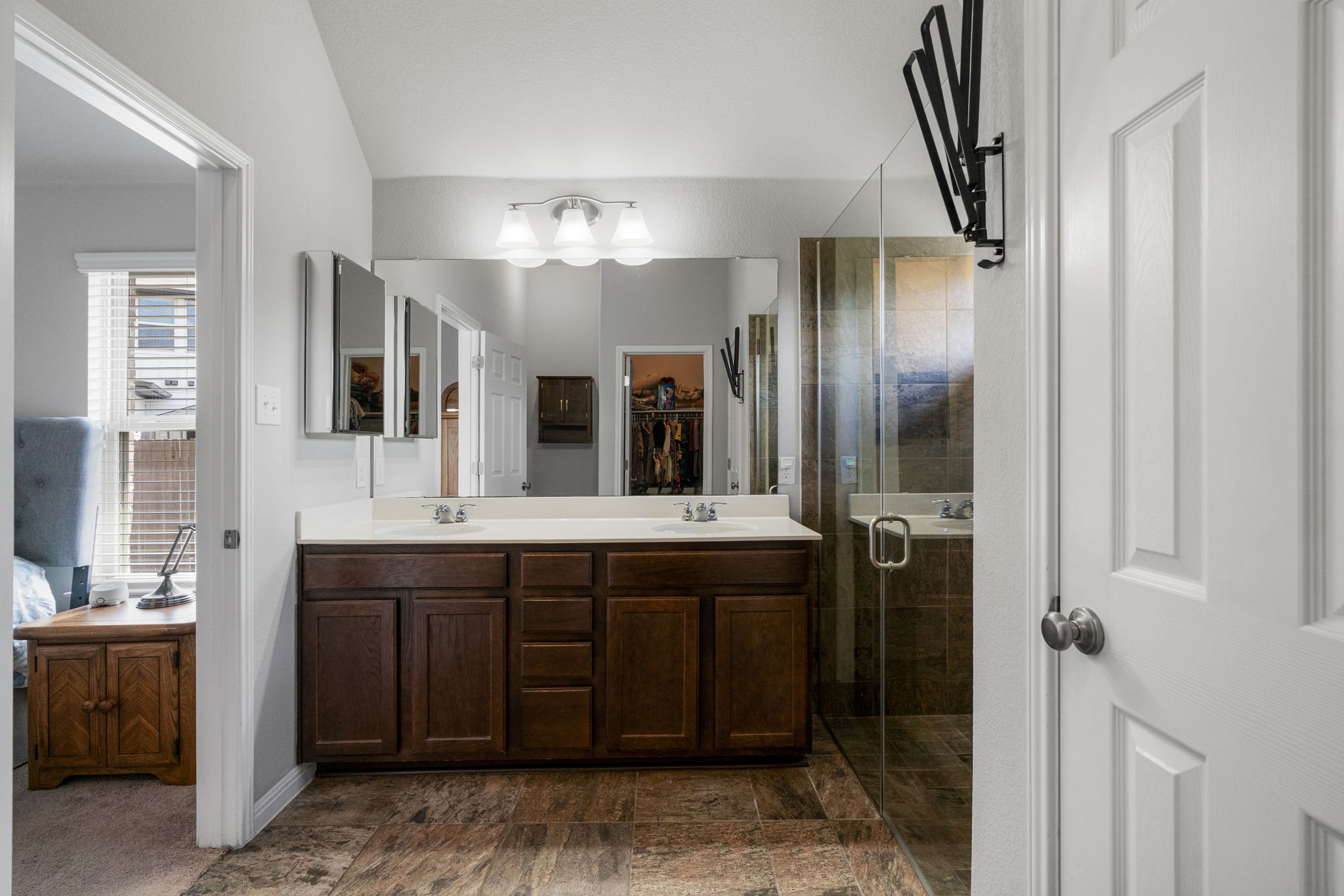 2009 Kates Cove Manchaca, TX 78652 - Photo 18 of 25 a spacious bathroom with a granite countertop sink and mirror