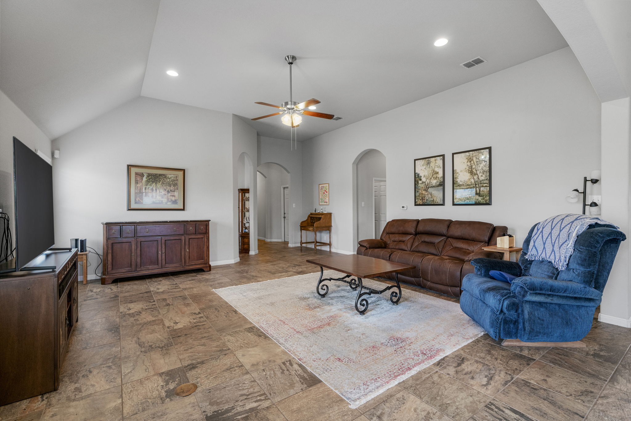 2009 Kates Cove Manchaca, TX 78652 - Photo 3 of 25 a living room with furniture gym equipment and a chandelier