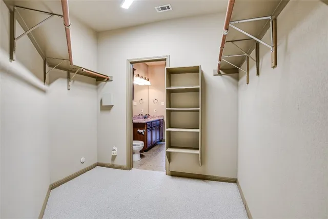 a view of storage and utility room with refrigerator