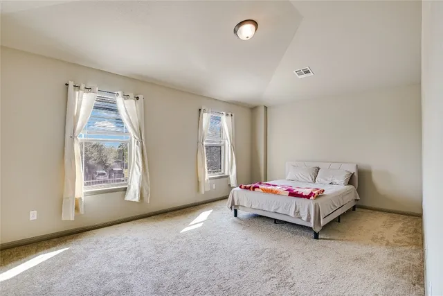 a living room with couch and window