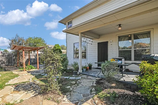 a backyard of a house with outdoor seating