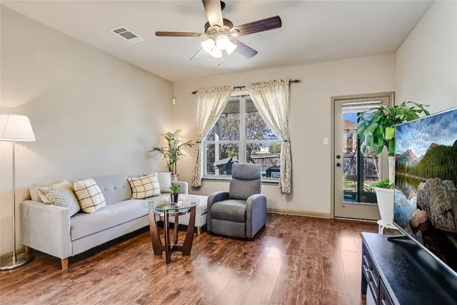 a living room with furniture and a large window