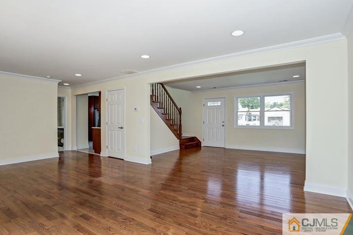 8 High Point Road East Brunswick, NJ 08816 - Photo 5 of 16 a view of an empty room with wooden floor and a window