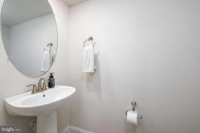 a bathroom with a sink and mirror