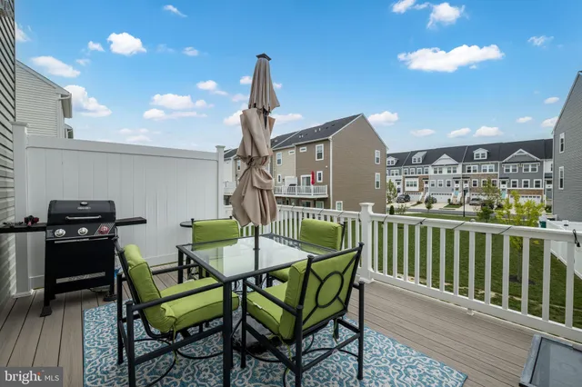 a view of a chairs and table in patio