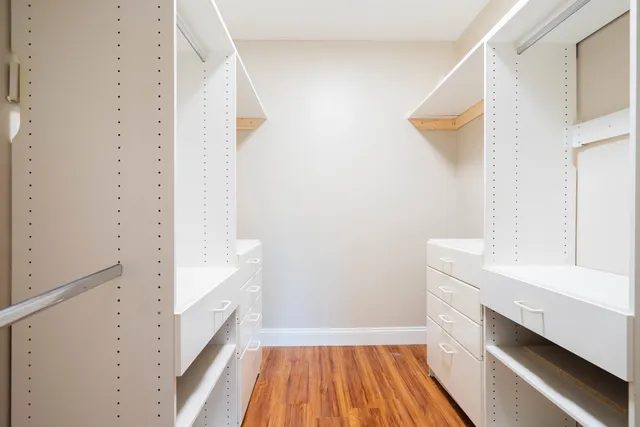 a view of bathroom with bathtub and wooden floor