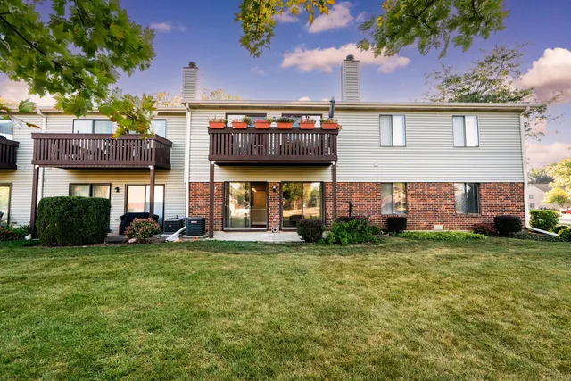 a view of a house with a back yard