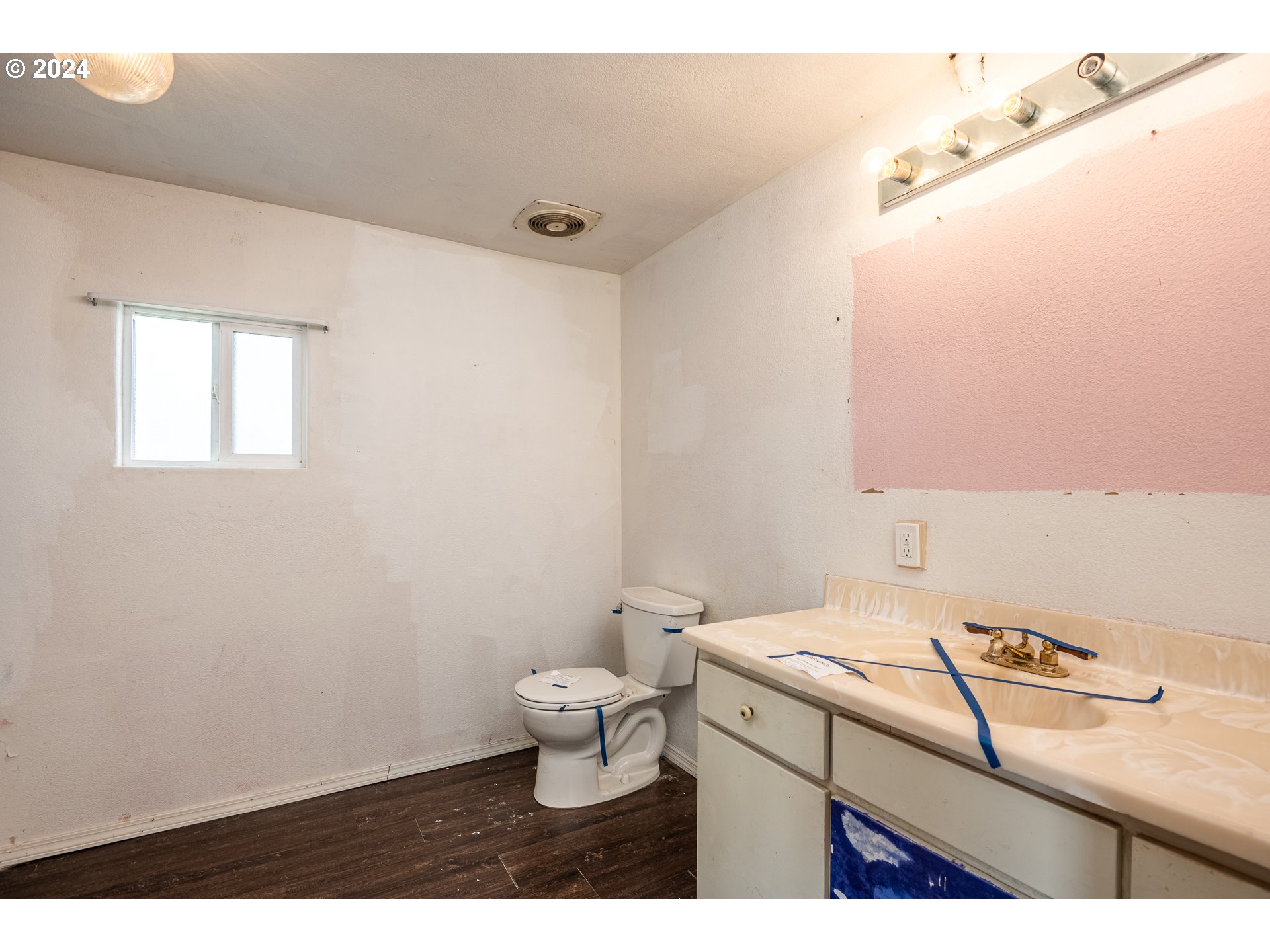 1487 30th Street Springfield, OR 97478 - Photo 24 of 37 a bathroom with a sink toilet and vanity