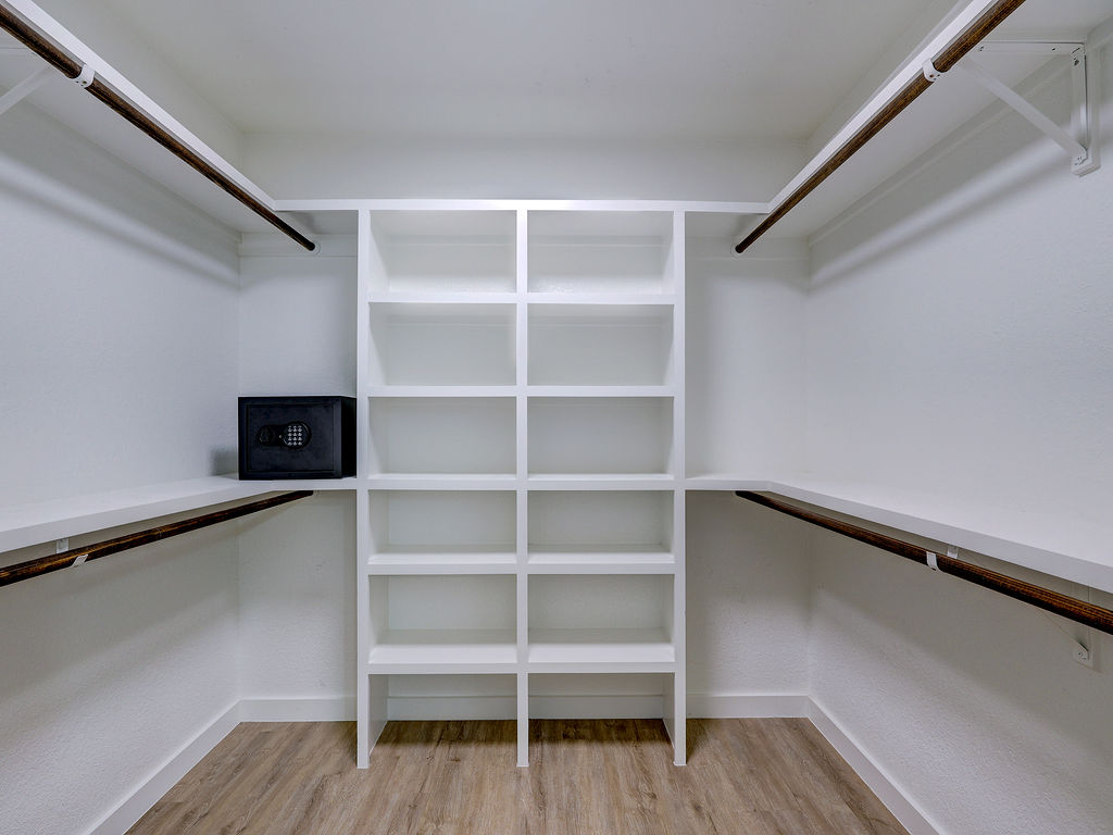 5842 Secrest Drive Austin, TX 78759 - Photo 33 of 40 Ample shelving and hanging space defines this organized, ready-to-use walk-in closet.