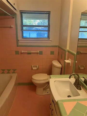 a bathroom with a sink and toilet