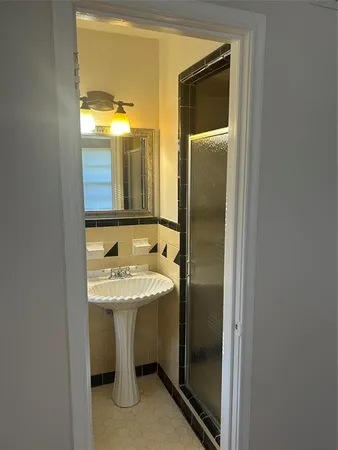 a bathroom with a sink and mirror