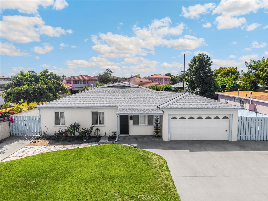 a aerial view of a house with table and chairs in a patio