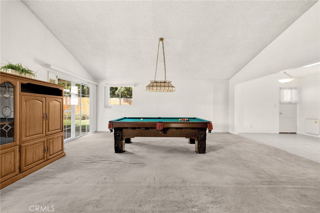 14721 Riata Street Midway City, CA 92655 - Photo 11 of 37 a room with pool table and windows